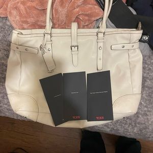 Off white TUMI ladies briefcase. Still have paperwork. No damage or stains.